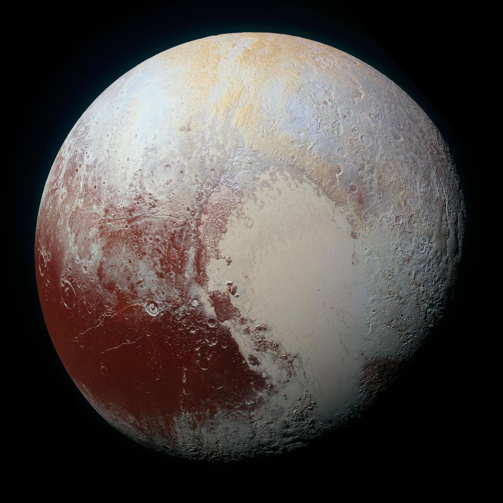 Pluto in enhanced color, with a pale heart-shaped plain surrounded by tan, red and blue-gray terrain